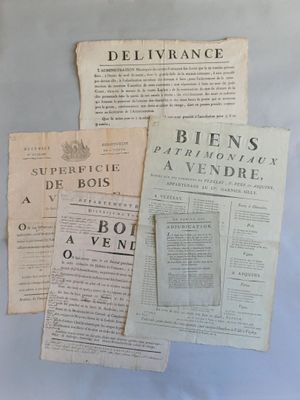 three old newspapers sitting on top of a table next to a cup of coffee