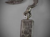 an image of a metal keychain with a hook attached to it