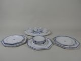 five plates and four cups on the table