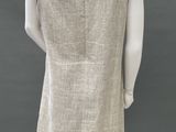 the back of a mannequin dress with a black trim