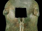 an image of a bronze statue of a woman holding a leaf