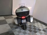 a motorcycle that is parked in a room with a checkered floor