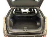 the back of a car with the trunk open and the seats down