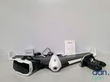 a remote control and a pair of shoes on a table