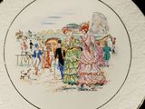 a plate with a picture of a couple and a dog on it