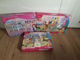 two boxes of toys sitting on a wooden floor next to each other