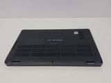 an open laptop computer sitting on top of a white table