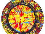 yellow, red, blue, and black abstract painting on a plate