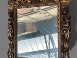 a mirror that is hanging on the wall in the room