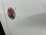 a close up of a car ' s emblem on the side of the car