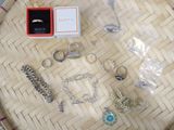 a lot of jewelry sitting on a basket on the table