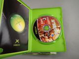 a close up of a xbox game in a green case