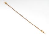 an image of a gold chain bracelet with a heart on it