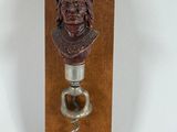 a bottle opener that has a picture of a man on it