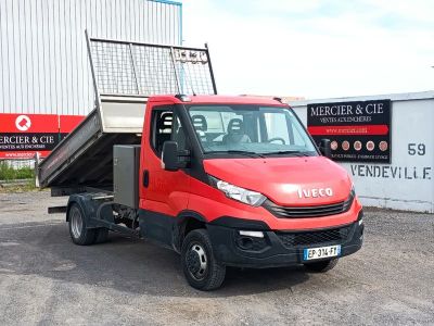 a red truck that is parked in front of a building