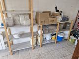 a room that has a bunch of shelves and boxes on it