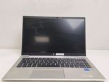 an open laptop computer sitting on top of a white table