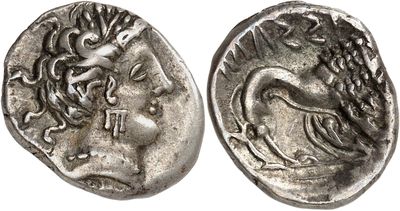 a silver coin with an image of a woman on it