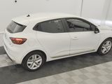 a picture of a white car parked in a garage