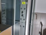 a bathroom with a shower and a sink in it