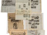 a lot of old newspapers on a white surface