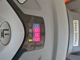 a close up of a clock on a car ' s dashboard