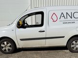 a van that is parked in front of a building
