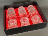 six glasses in a box with a red ribbon around them