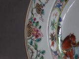 a plate with a picture of a horse and flowers on it