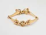 an image of a gold bracelet on a white background