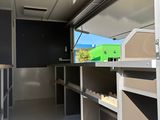 an image of a food truck with a lot of shelves