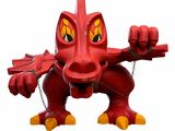 une statue de dragon rouge avec une chaîne autour du cou