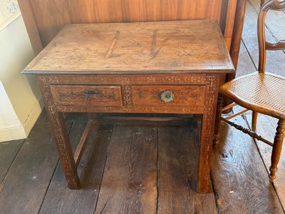 a small wooden table with a drawer underneath it