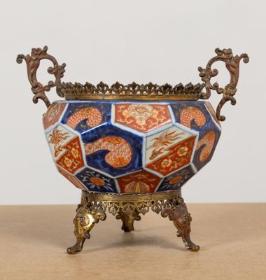 a vase that is sitting on a stand on a table