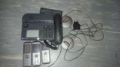a laptop, a cell phone, and a mouse on a table
