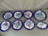 six assiettes bleues recouvertes de glaçage blanc et parsemées de vermicelles