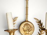 an image of a wall mounted candle holder with two candles