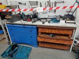 a workbench with tools on it in a garage