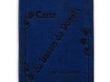 a blue book sitting on top of a white surface