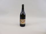 a bottle of wine that is sitting on a table
