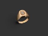 a gold signet ring with a square stone in the center