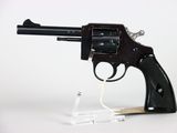 gun on a white background with a clear plastic holder
