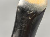 a close up view of a pair of black leather shoes