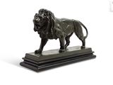 statue of a lion on a marble base on a white background