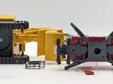 a yellow and black toy truck and a yellow and black toy tractor
