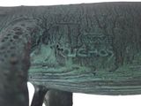 a bronze statue of a horse with a name written on it