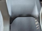 a seat on a bus that has a seat cushion on it