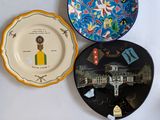 three plates on the wall with a picture on them