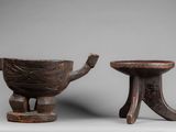 two small wooden bowls and a small bowl on a stand