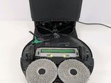 a picture of a robotic vacuum cleaner with two circular wheels